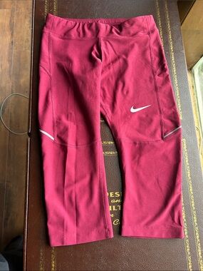 Nike women’s Burgundy Capri Leggings with White Swoosh